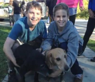 teens save dog stuck in mud