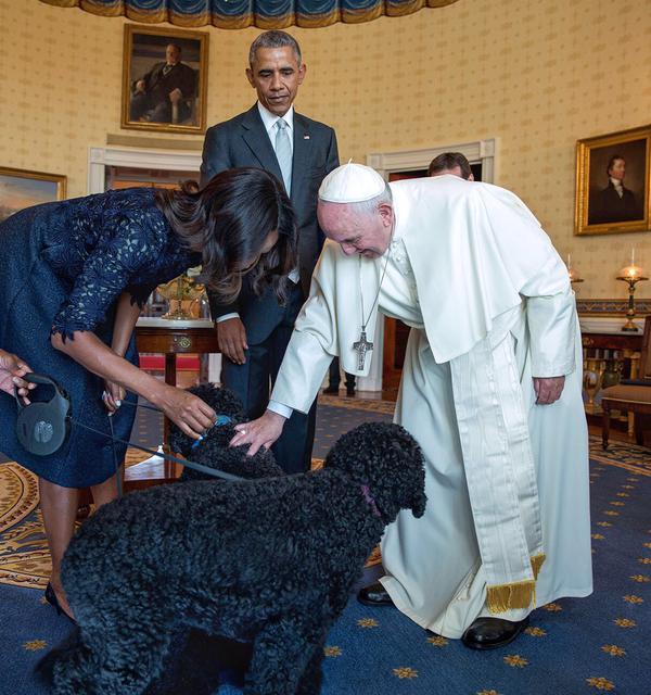Pope Francis pets Bo and Sunny Obama