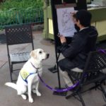 Aww! Service Dog-in-Training Poses for Caricature at Disneyland